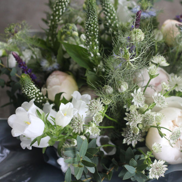A close up photograph of a beautiful bouquet of Peony flowers, created in the Pod & Pip workshop