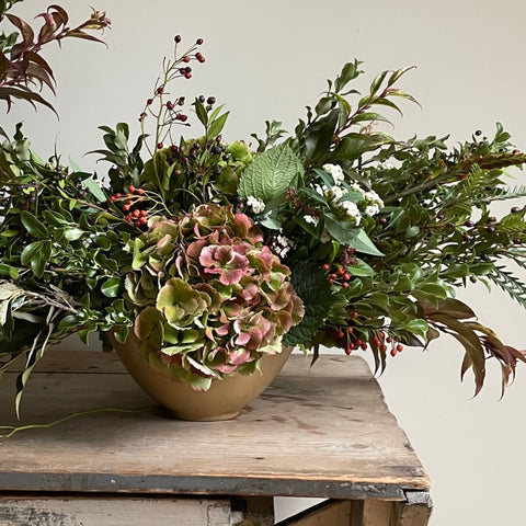A beautiful autumn themed display of flowers, created by Pod & Pip within their workshop